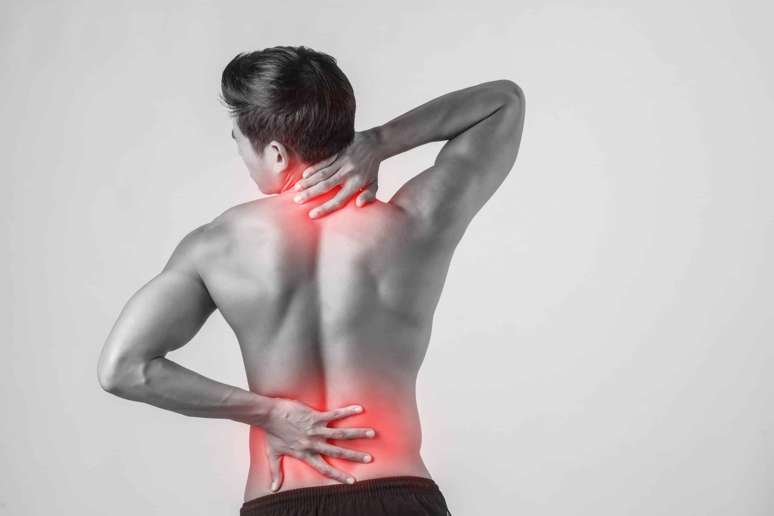 close-up-man-rubbing-his-painful-back-isolated-white-background-scaled Non Surgical Lower Back Pain Treatment